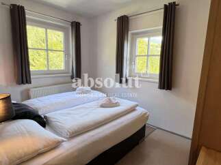 Discover a cozy bedroom with natural light and a comfortable bed, perfect for relaxation.