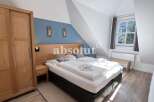 Discover a cozy bedroom retreat in this charming property.