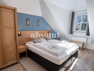 Discover a cozy bedroom retreat in this charming property.
