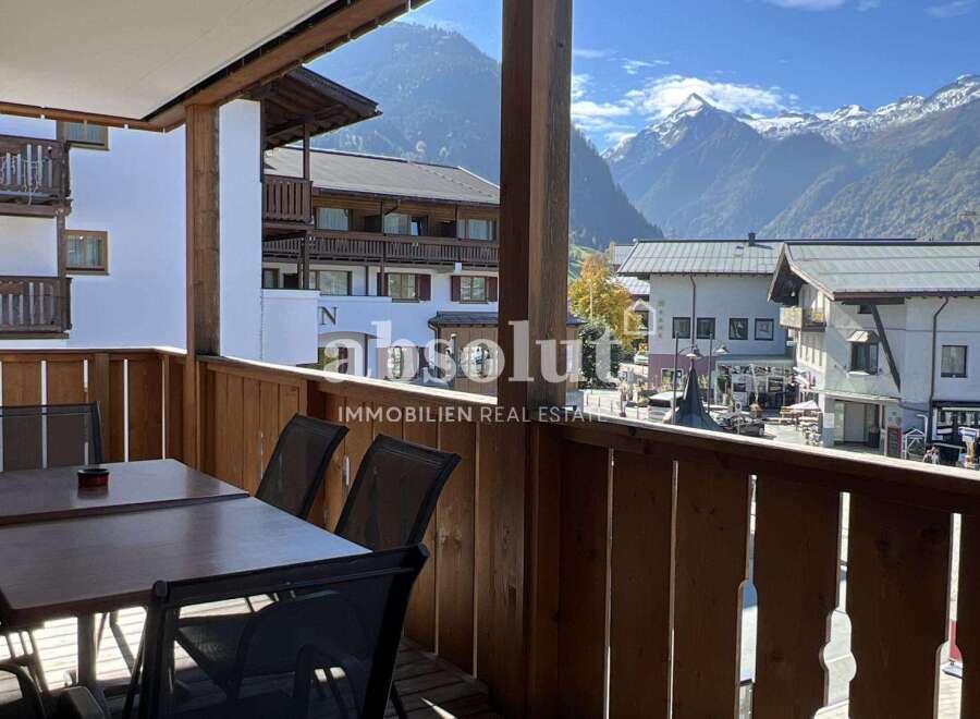 Enjoy breathtaking mountain views from this charming balcony.
