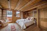 Step into a cozy bedroom retreat, where rustic charm meets modern comfort.