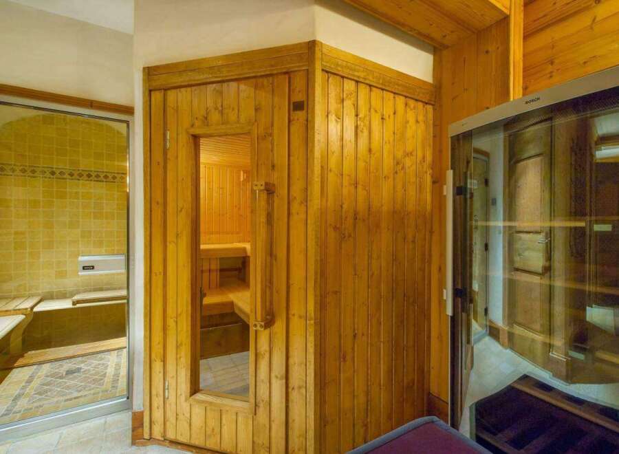 Step into luxury with this stunning property featuring a private sauna and a beautifully tiled shower.