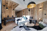 Experience rustic elegance in this stunning property, featuring exquisite wood paneling throughout.