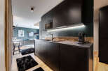 Step into modern luxury with this stunning kitchen, perfect for culinary enthusiasts.