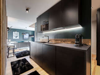 Step into modern luxury with this stunning kitchen, perfect for culinary enthusiasts.