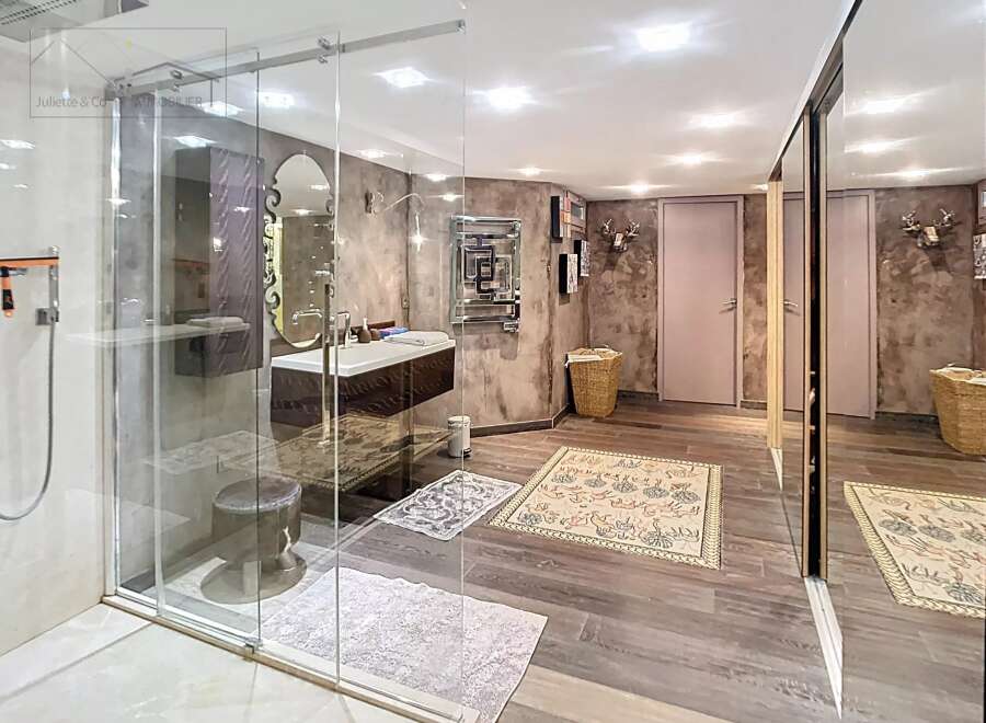 Step into luxury with this stunning bathroom! Featuring a sleek glass shower, elegant vanity, and stylish decor, this space is designed for relaxation.