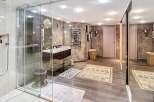 Step into luxury with this stunning bathroom! Featuring a sleek glass shower, elegant vanity, and stylish decor, this space is designed for relaxation.