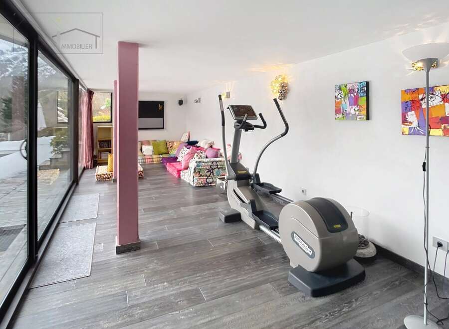 This stunning property boasts a modern gym area, perfect for maintaining a healthy lifestyle.