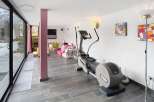 This stunning property boasts a modern gym area, perfect for maintaining a healthy lifestyle.