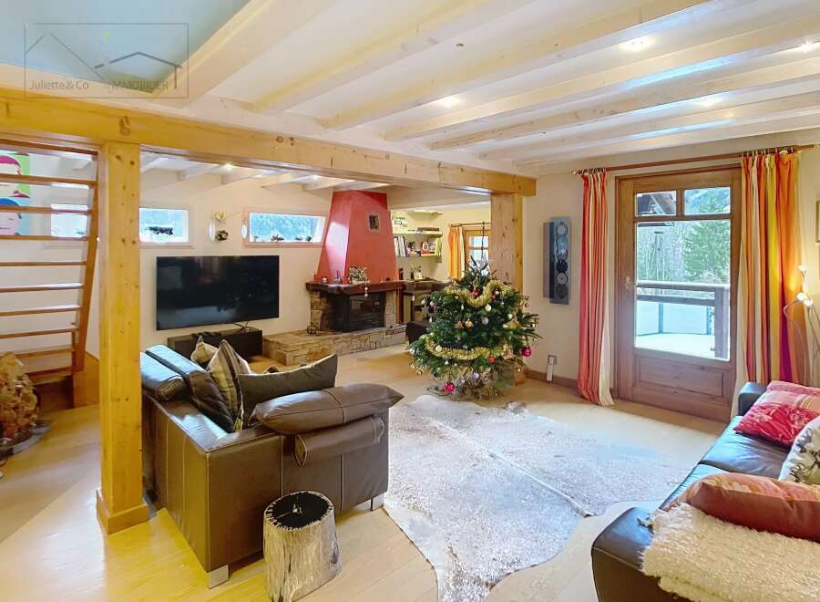 This stunning property boasts a cozy living room with a fireplace, perfect for relaxing evenings.