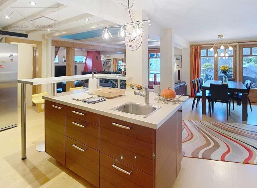 This stunning kitchen boasts a modern design with sleek cabinetry and a spacious layout, perfect for culinary enthusiasts.