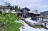 Discover a stunning chalet nestled in a picturesque mountain setting.