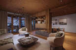 Experience luxury living in this stunning property, featuring a cozy living room with a fireplace and plush seating.