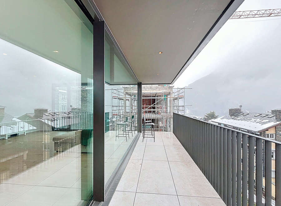 Experience breathtaking views from this modern balcony.