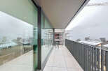 Experience breathtaking views from this modern balcony.
