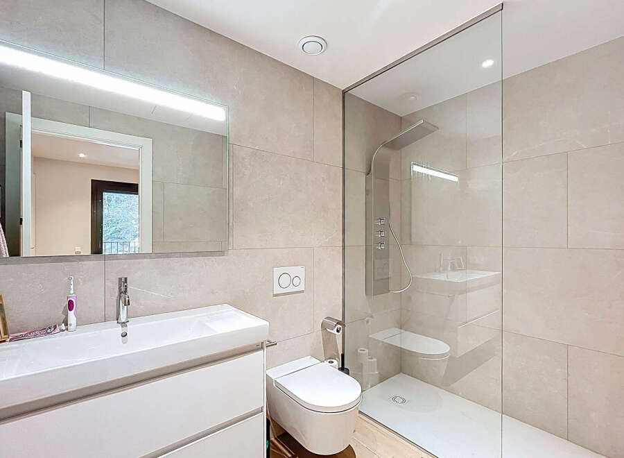 Step into a modern oasis with this stunning bathroom design.