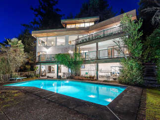 This stunning property boasts a luxurious outdoor pool, perfect for relaxation and entertainment.