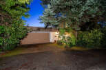 Discover the charm of this stunning property, featuring a beautifully designed garage and a welcoming facade.