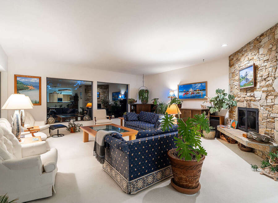 This stunning living room boasts a cozy fireplace, perfect for chilly evenings.