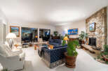 This stunning living room boasts a cozy fireplace, perfect for chilly evenings.