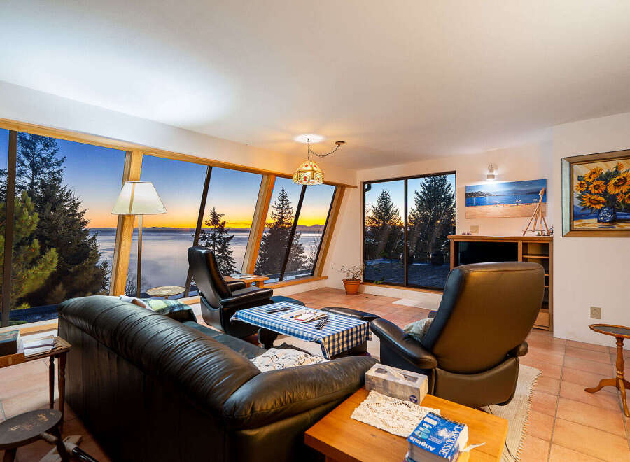 Experience breathtaking views from this stunning property, featuring expansive windows that frame the natural beauty of the surroundings.