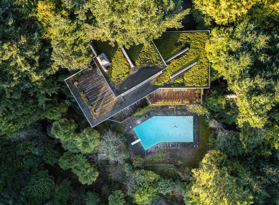 Discover a unique architectural gem nestled in a lush, green oasis.
