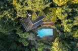 Discover a unique architectural gem nestled in a lush, green oasis.