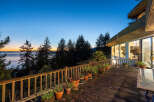 Enjoy breathtaking sunsets and panoramic ocean views from this stunning property.