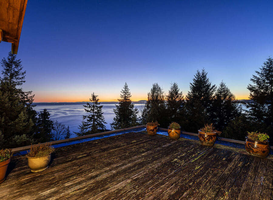 Enjoy breathtaking sunsets and serene water views from this stunning property.