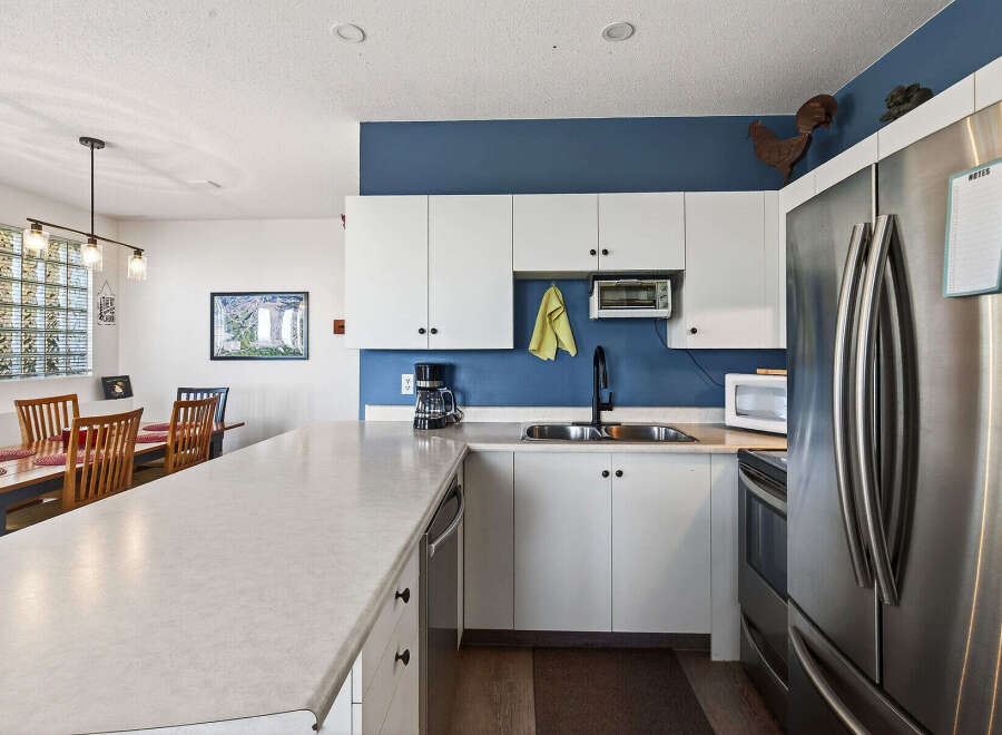 This stunning kitchen boasts modern appliances and ample counter space, perfect for culinary enthusiasts.