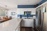 This stunning kitchen boasts modern appliances and ample counter space, perfect for culinary enthusiasts.