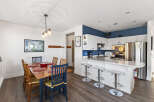 This stunning property boasts a beautifully designed kitchen with modern appliances and ample counter space, perfect for culinary enthusiasts.