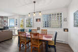 This charming dining area offers a warm and inviting space for meals and gatherings.