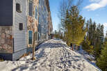 Discover a stunning property nestled in a serene, snow-covered landscape.