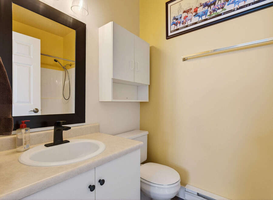 This charming bathroom features a bright and airy design, perfect for starting your day.