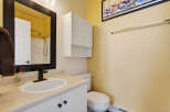 This charming bathroom features a bright and airy design, perfect for starting your day.