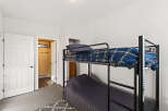 This cozy bedroom features a bunk bed, perfect for maximizing space.