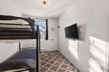 Cozy bedroom featuring a bunk bed, perfect for accommodating guests or family members.