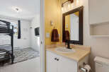 Discover this charming property featuring a well-appointed bathroom with a stylish vanity and a modern sink.