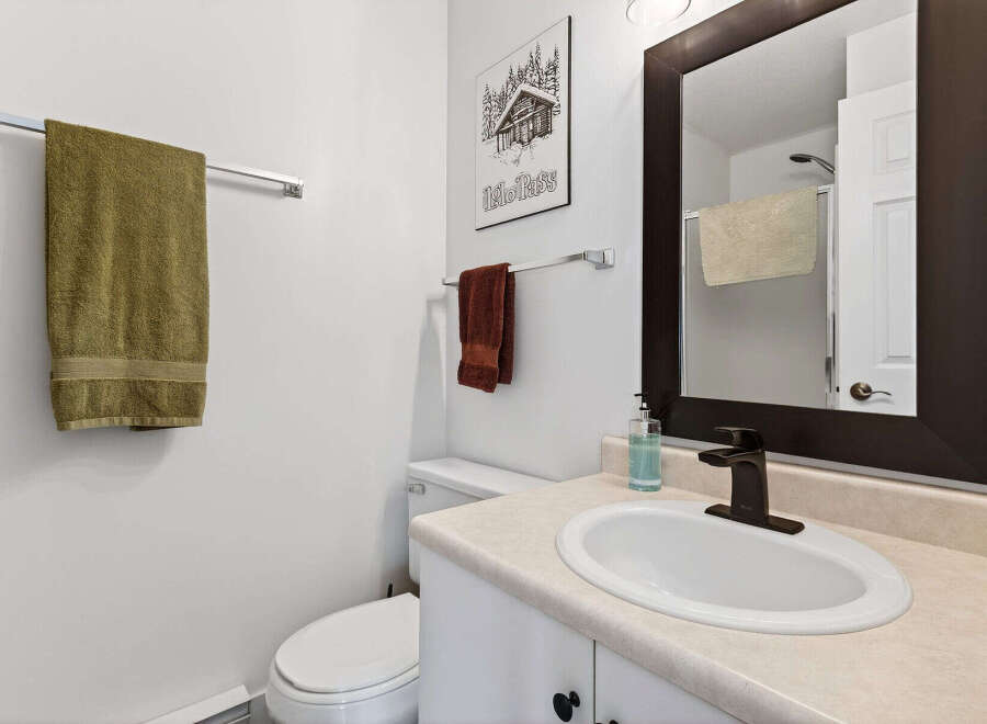 This inviting bathroom features a clean and modern design, perfect for a relaxing retreat.