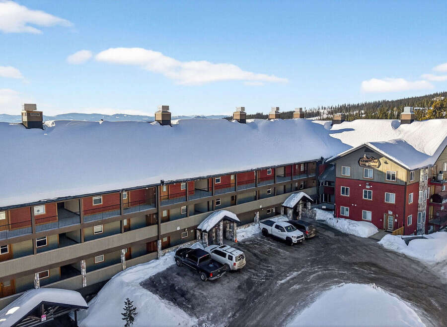 Discover the charm of Chateau The Ridge Resort, a stunning property nestled in a winter wonderland.