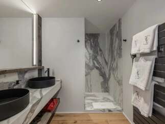 Step into luxury with this stunning bathroom featuring a sleek design and high-end finishes.