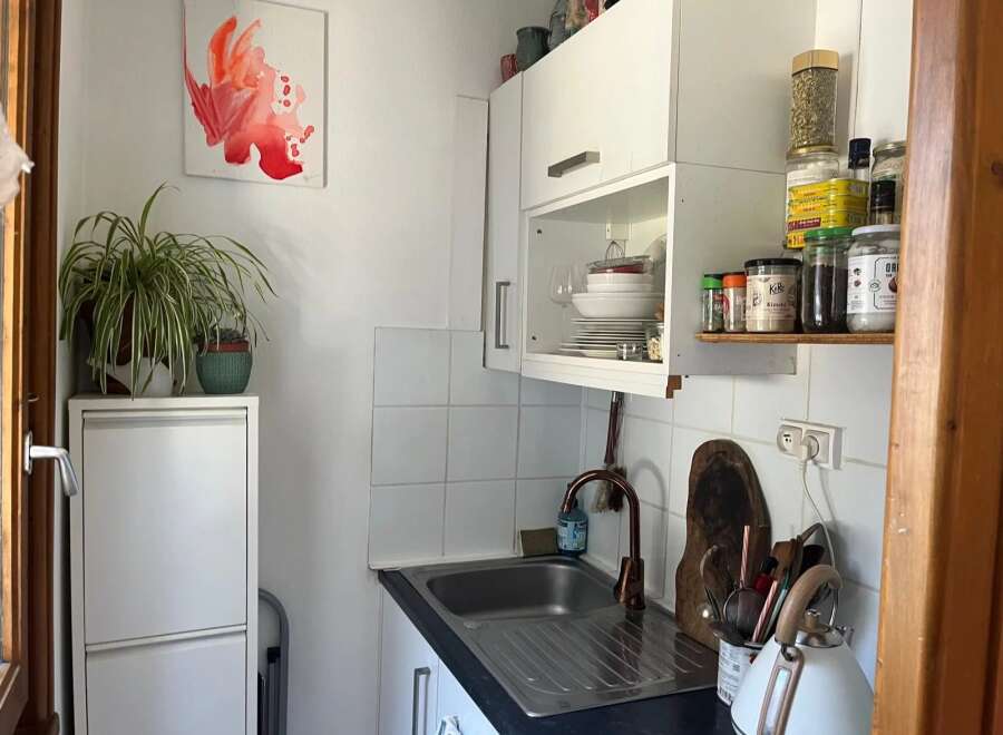 Discover the charm of this cozy kitchen, perfect for culinary adventures.