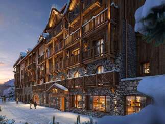 Experience the charm of this stunning mountain lodge, featuring a beautiful blend of stone and wood architecture.