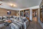 Step into luxury with this stunning living space, featuring a cozy sectional sofa and a plush faux fur throw.