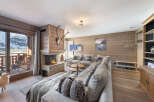 Experience the epitome of luxury living in this stunning chalet, boasting a cozy fireplace and a spacious, inviting living area.