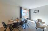 Experience luxury living in this stunning property, featuring a spacious dining area perfect for entertaining.