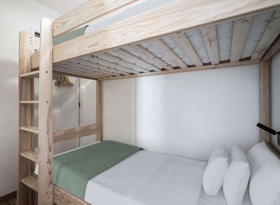 This cozy bedroom features a stylish bunk bed, perfect for maximizing space.