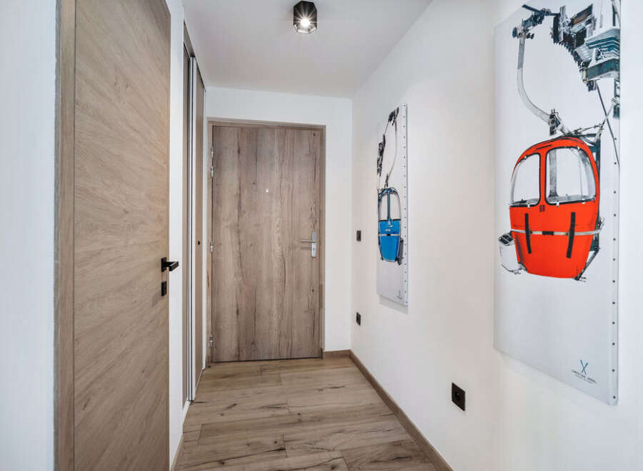 Step into this inviting hallway, showcasing a blend of modern design and natural elements.