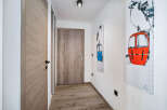 Step into this inviting hallway, showcasing a blend of modern design and natural elements.